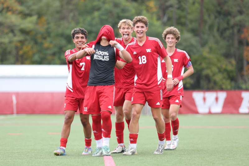 a group of people in red uniforms