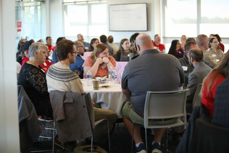 a group of people sitting at a table