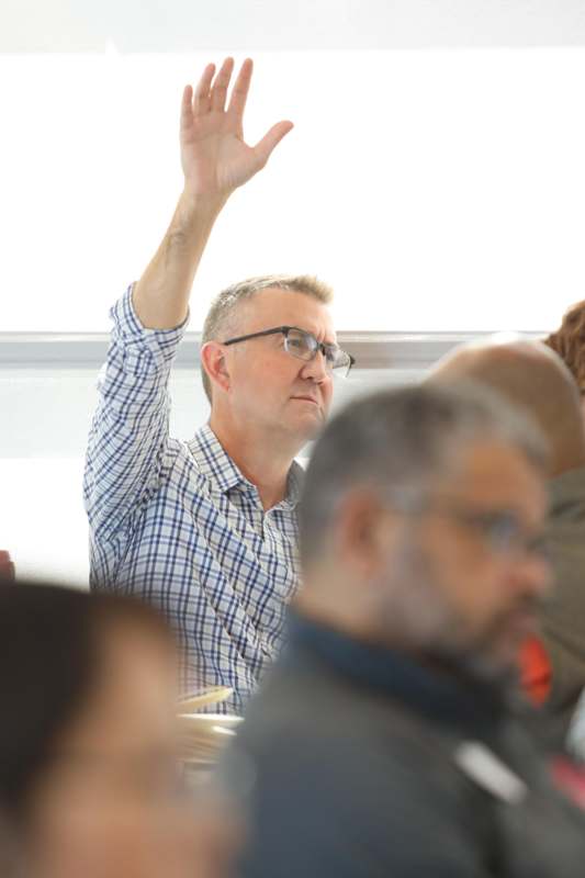 a man raising his hand