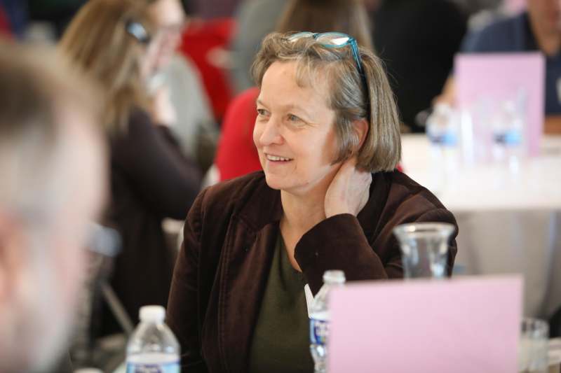 a woman sitting at a table