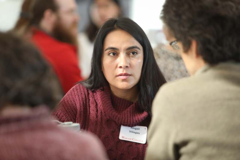 a woman in a maroon sweater