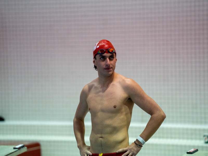 a man in swimsuit and swimming cap