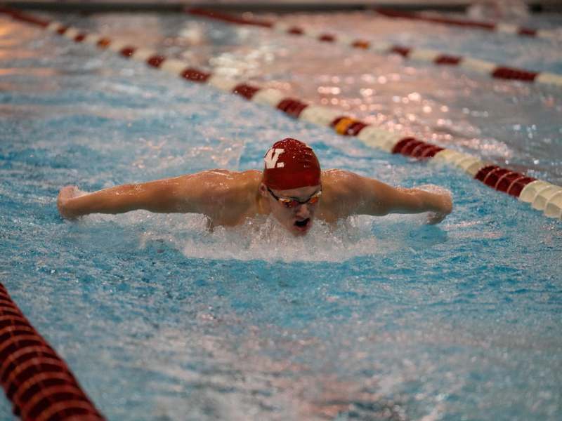 a man swimming in a pool