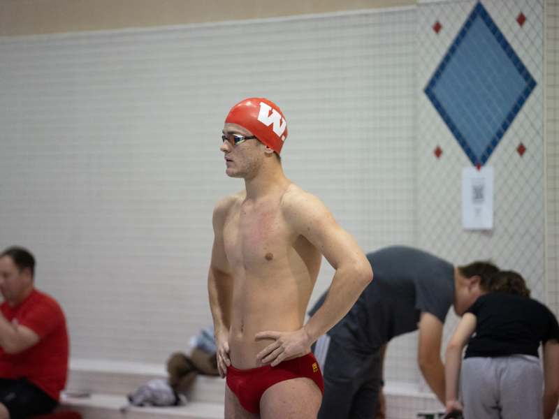 a man in swimsuit and swimming cap