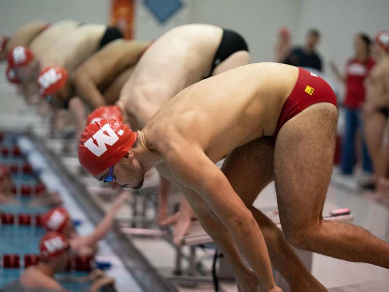 a group of swimmers in swim gear