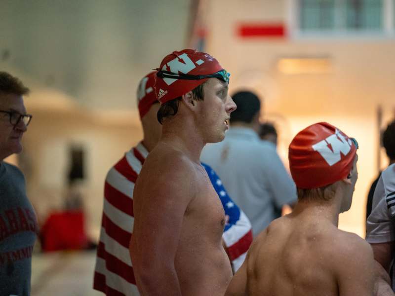 a group of swimmers in a swimming pool