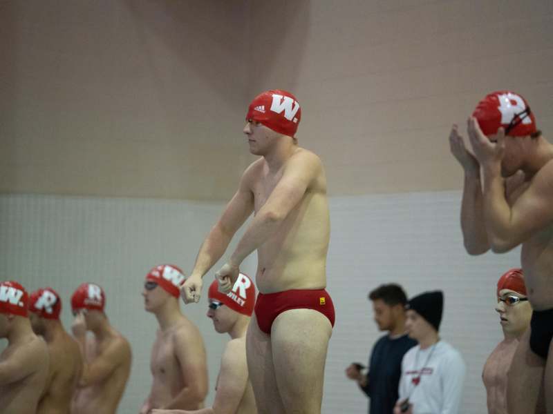 a group of men in swim caps