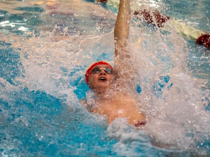 a man swimming in a pool