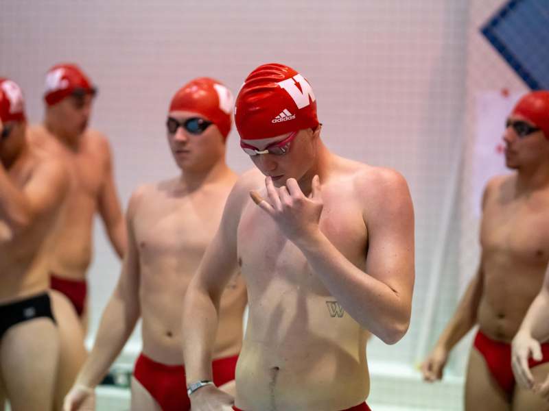 a group of men in swim suits