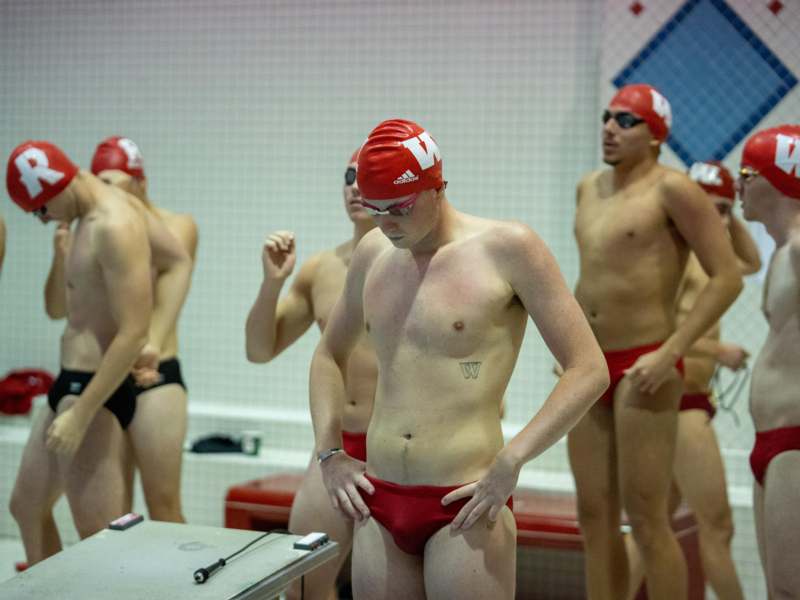 a group of men in swimsuits