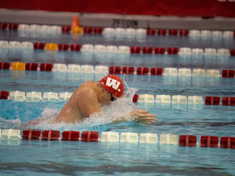 a man swimming in a pool