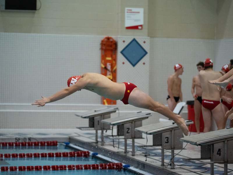 a man diving into a pool
