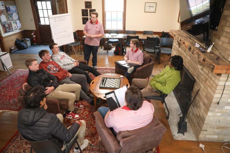 a group of people sitting around a table