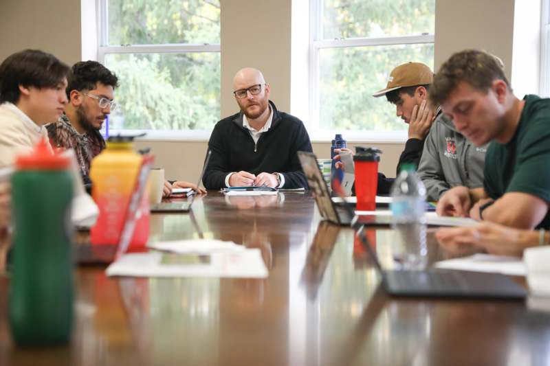 a group of people sitting around a table