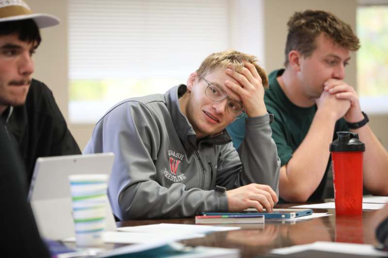 a group of people sitting at a table