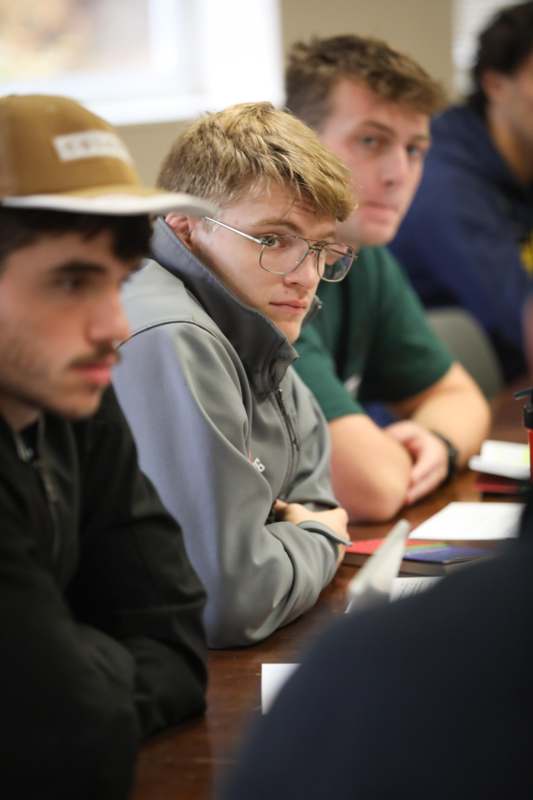 a group of people sitting at a table