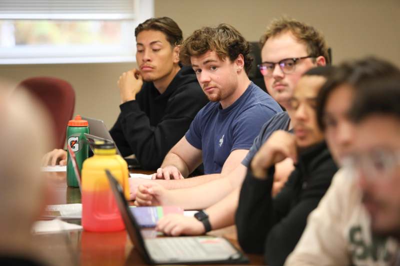 a group of people sitting at a table