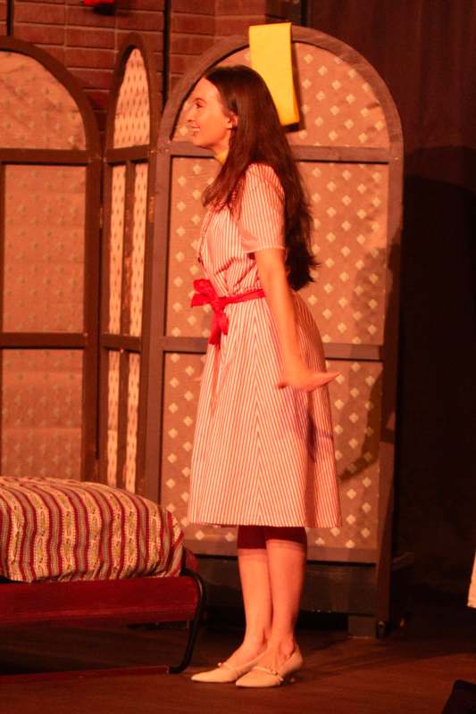 a woman in a striped dress