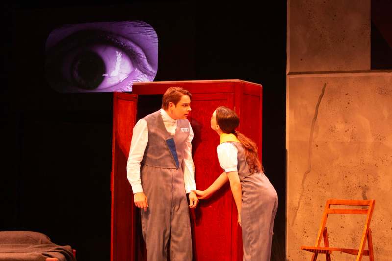 a man and woman on stage