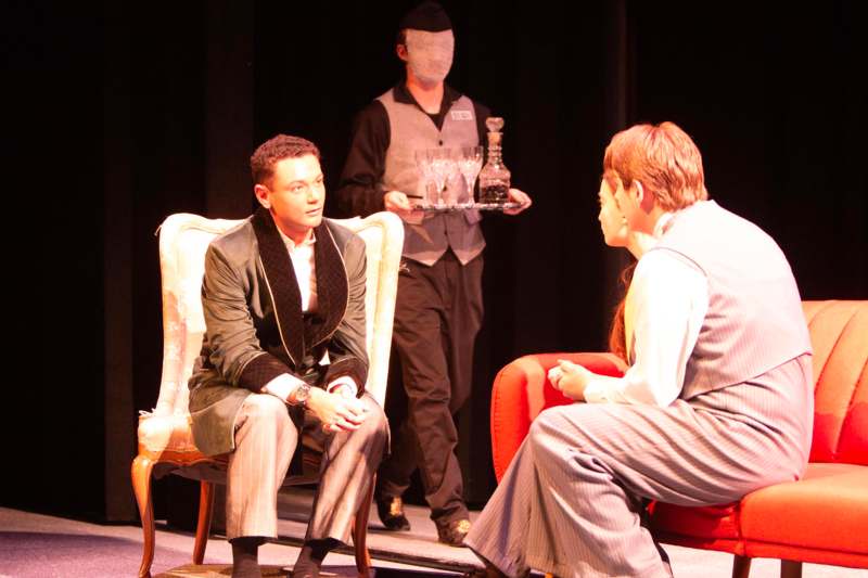 a group of men sitting in chairs