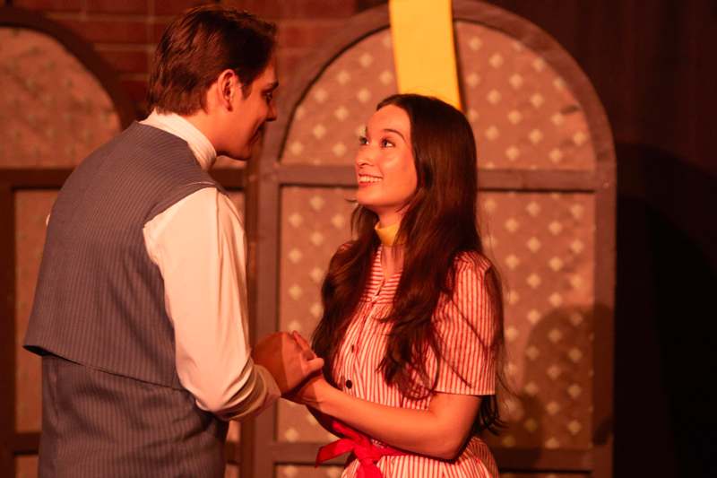 a man and woman holding hands