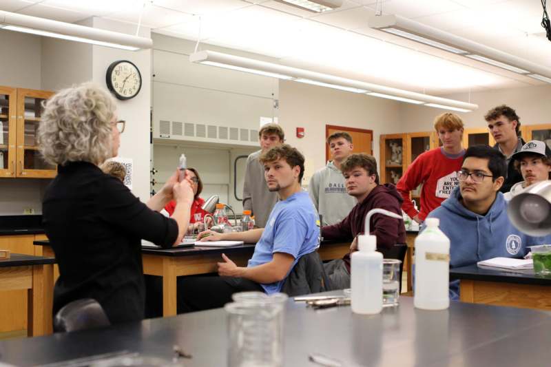 a group of people sitting around a table