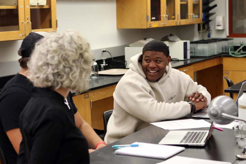 a man and woman sitting at a table
