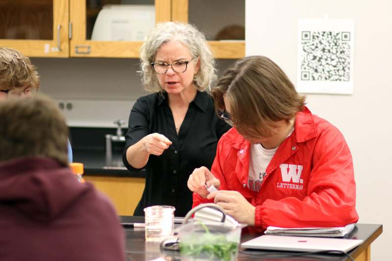 a woman pointing at a woman