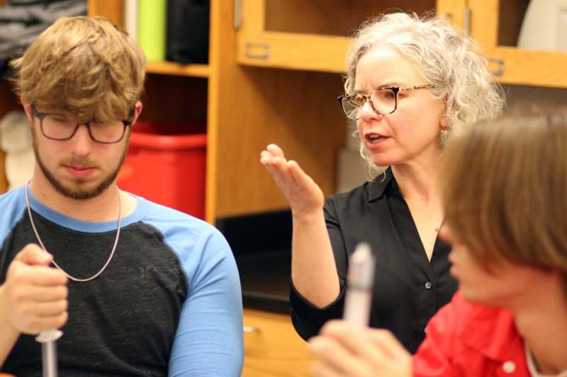 a woman talking to a man