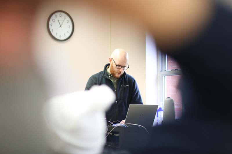 a man looking at a laptop