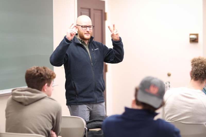 a man standing in front of a group of people