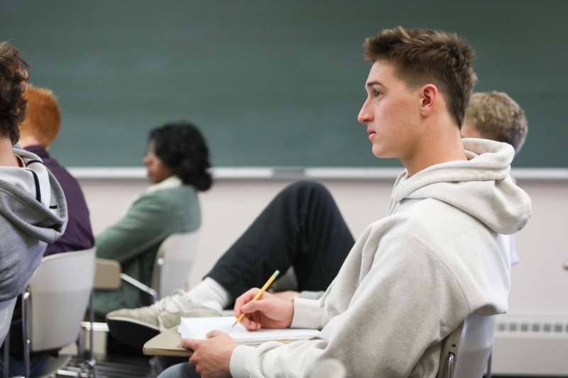 a man sitting in a classroom