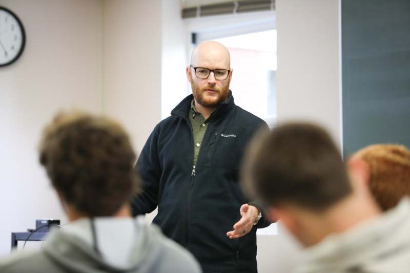 a man standing in front of a group of people