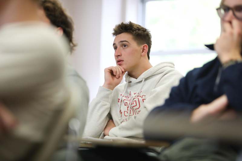 a man sitting in a classroom