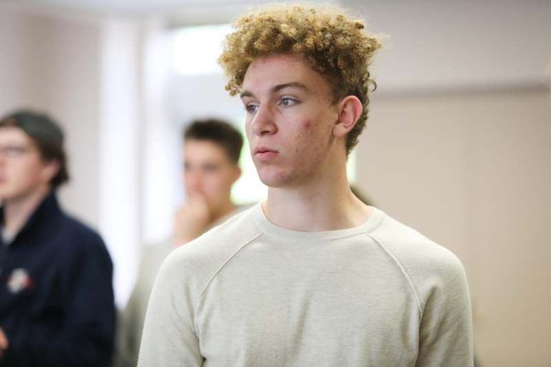 a man looking away from other people