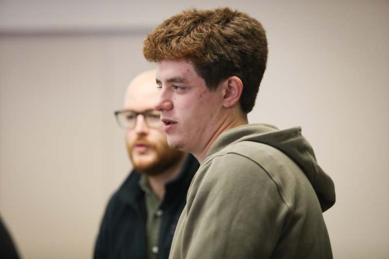 a man in a green jacket