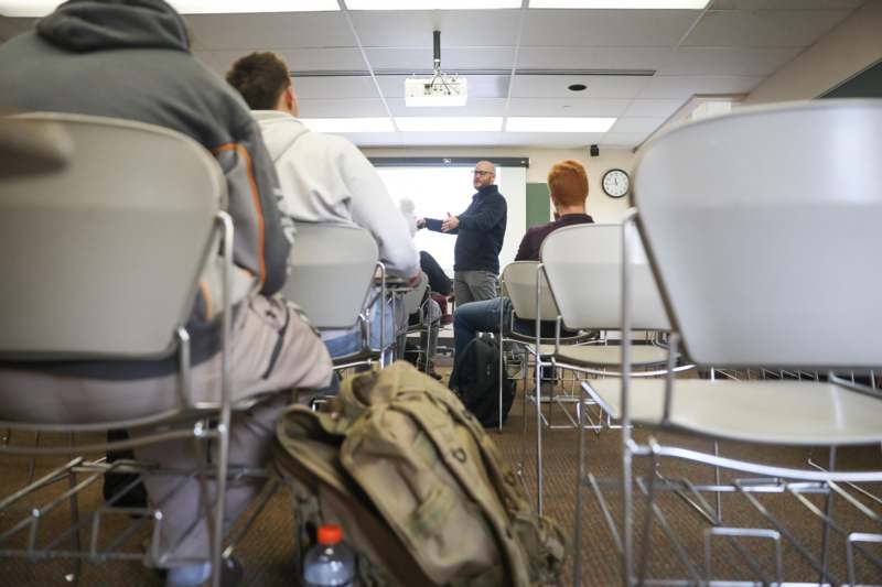 a man giving a presentation in a classroom