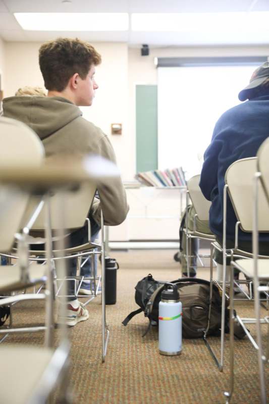 a group of people sitting in chairs