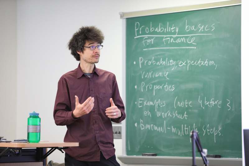 Classroom: MAT 277 with Professor Timur Akhunov - a man standing in front of a chalkboard