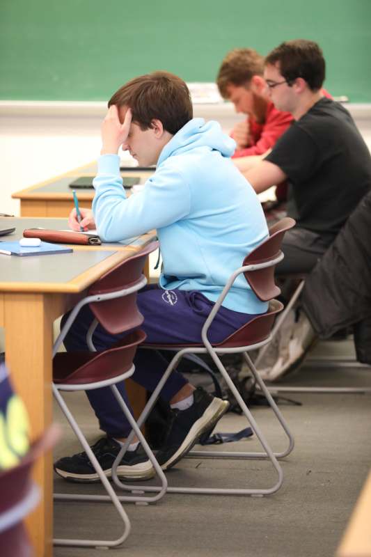 a group of people sitting at a desk