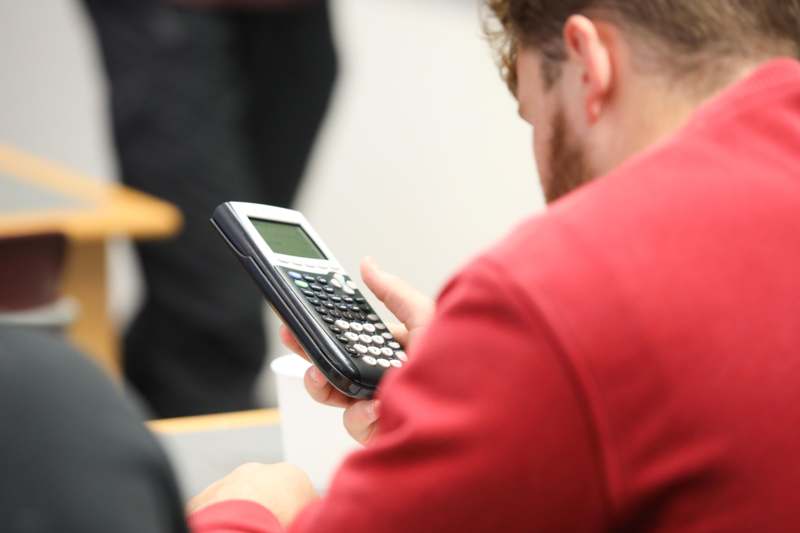 a man using a calculator