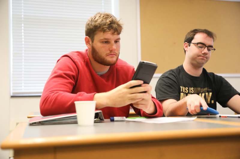 a man looking at a phone