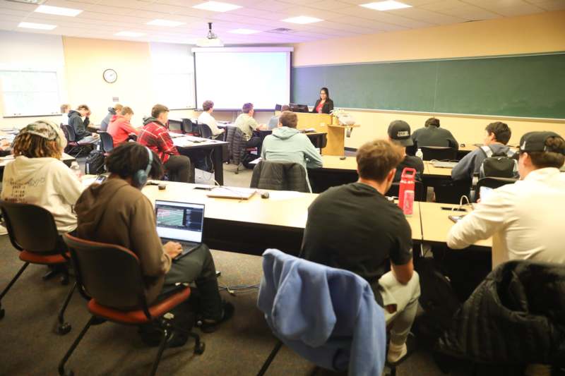 Classroom: ECO 101 with Professor Sujata Saha - a group of people in a classroom