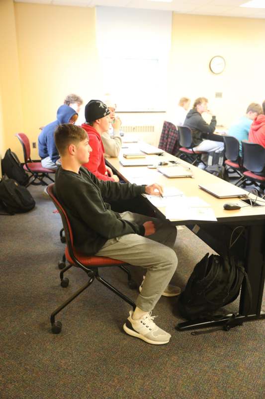 a group of people sitting at a table
