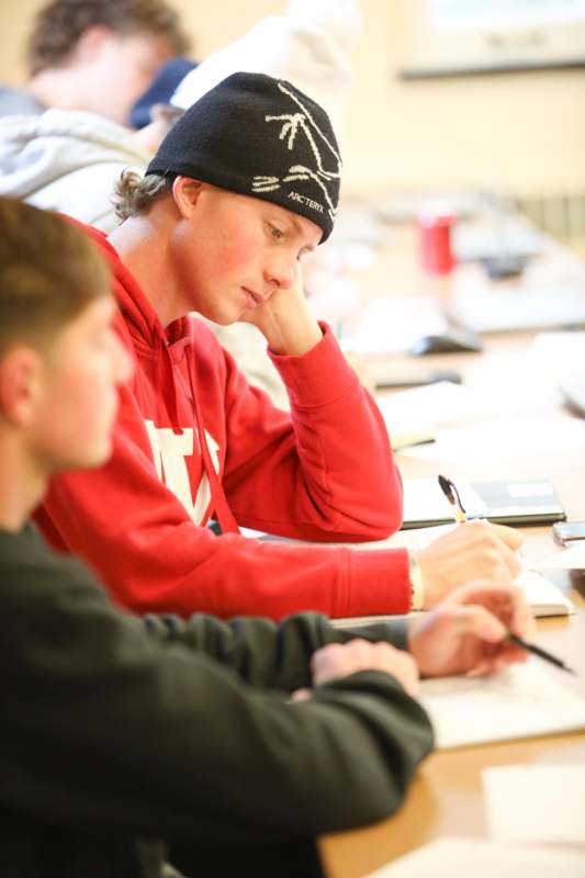 a group of people sitting at a table