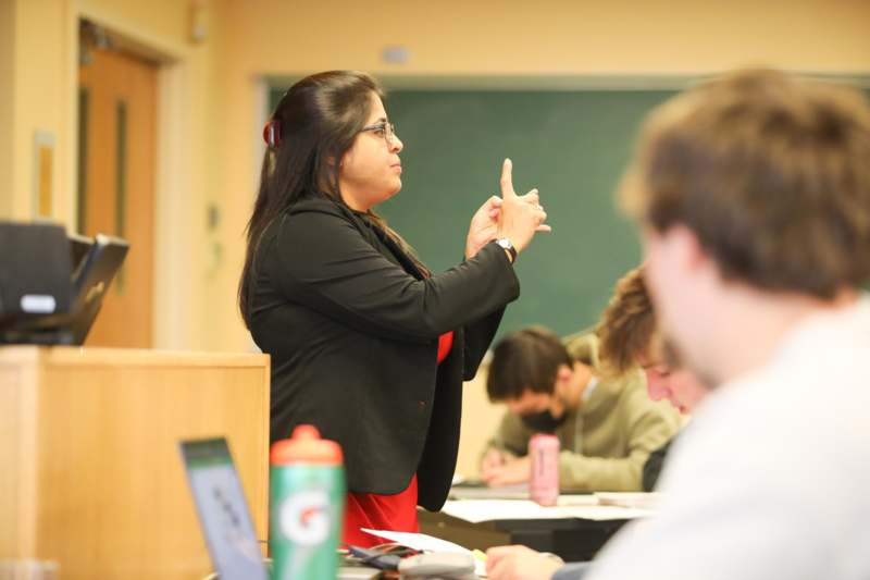 a woman pointing at something