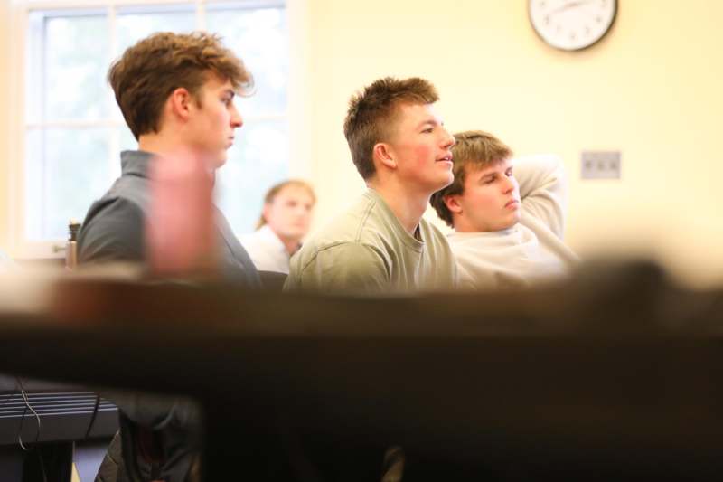 a group of men sitting in a room