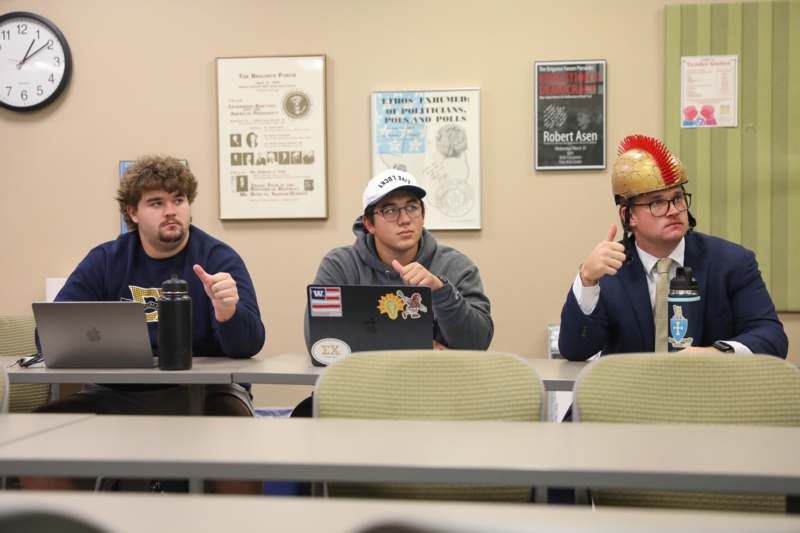 Classroom: RHE 350 with Professor Jennifer Abbott - a group of men sitting at a table