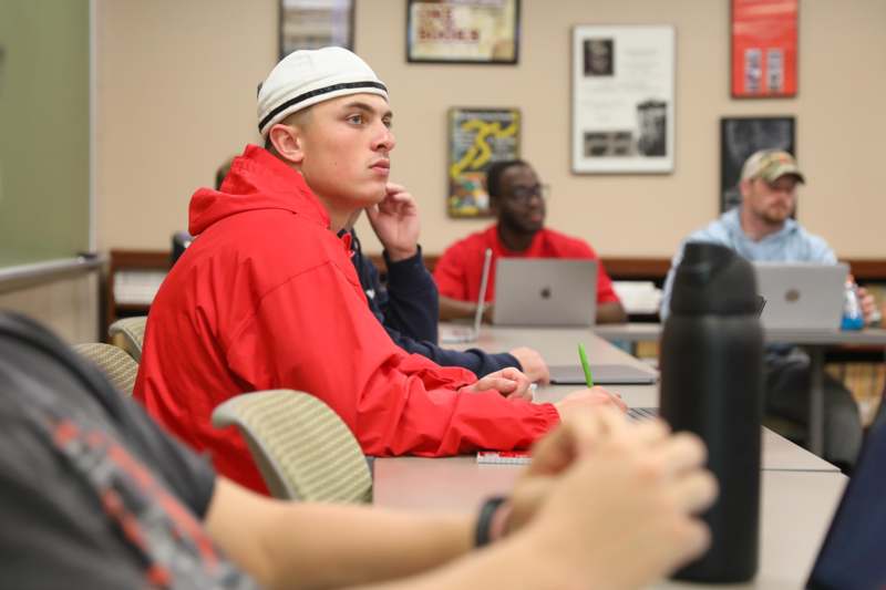 a group of people sitting at a table