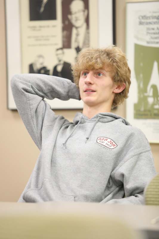 a man in a grey sweatshirt